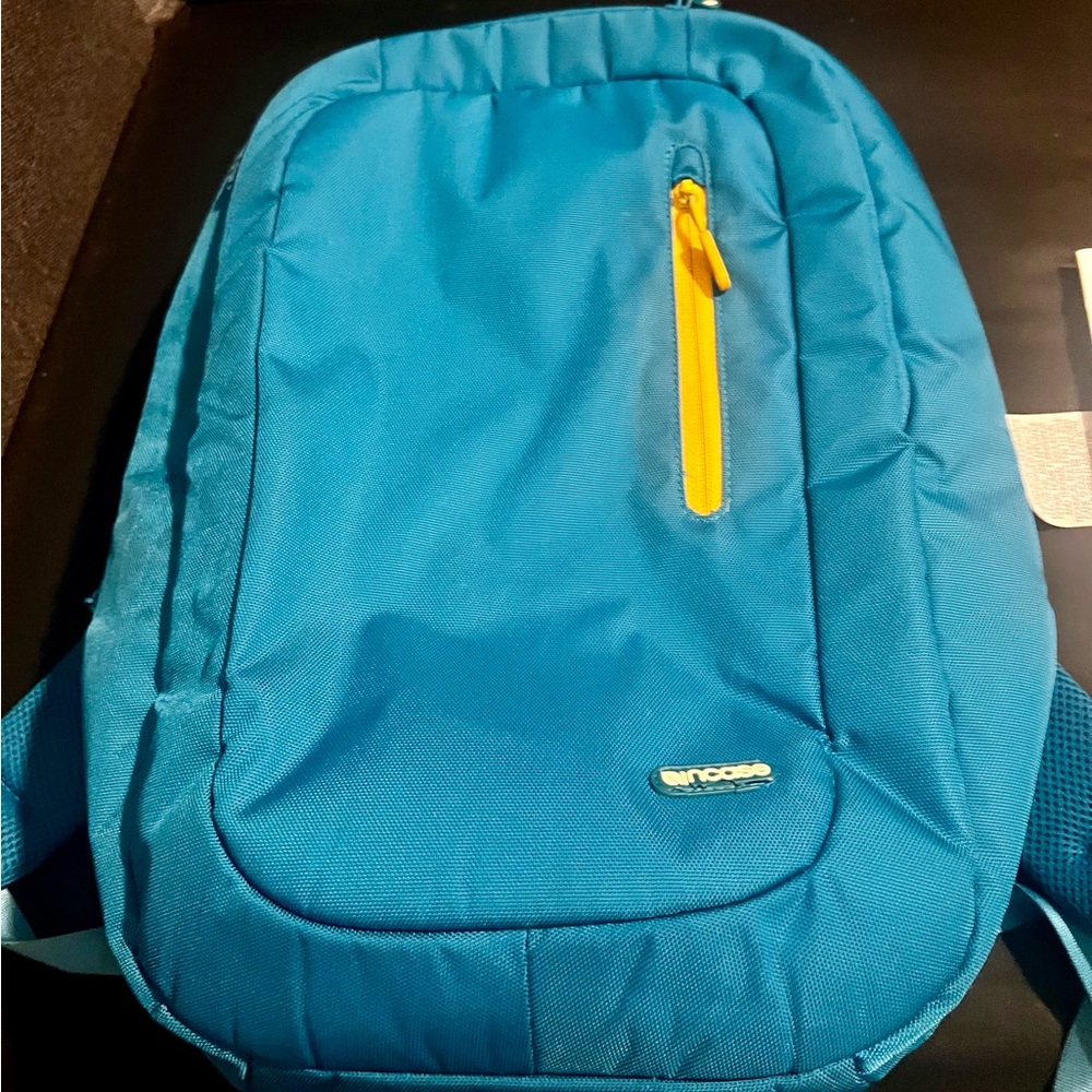 Incase Teal Backpack with Yellow Zipper